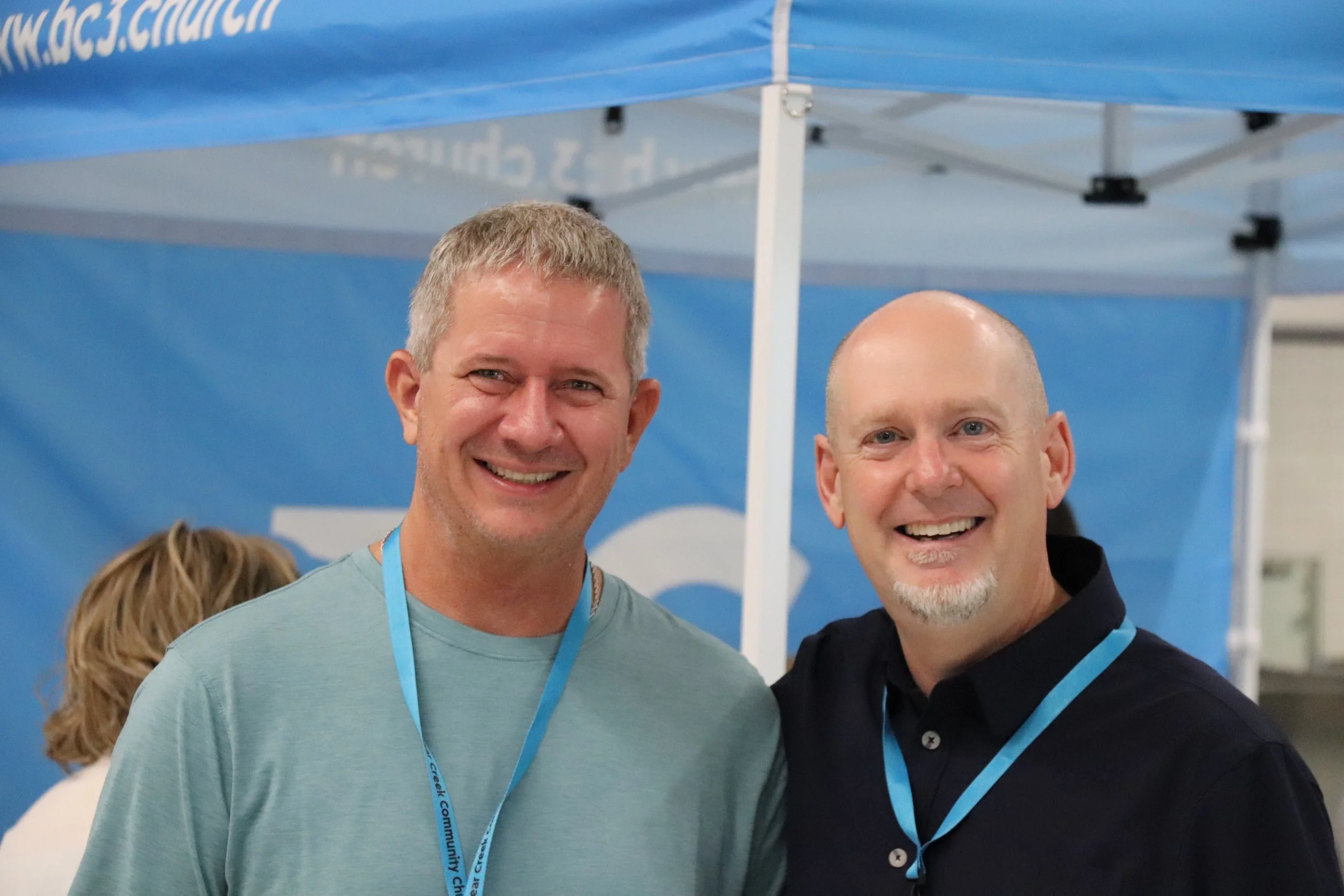Two men smiling happy to be at church