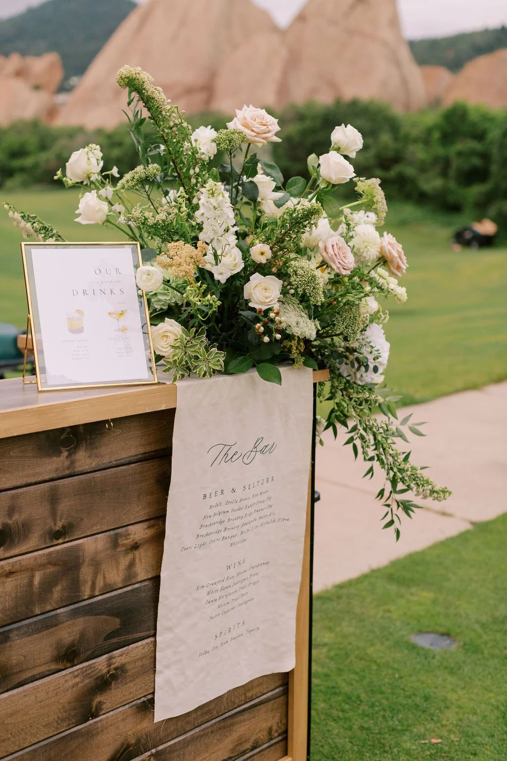 Lush floral arrangement placed on the corner of a bar