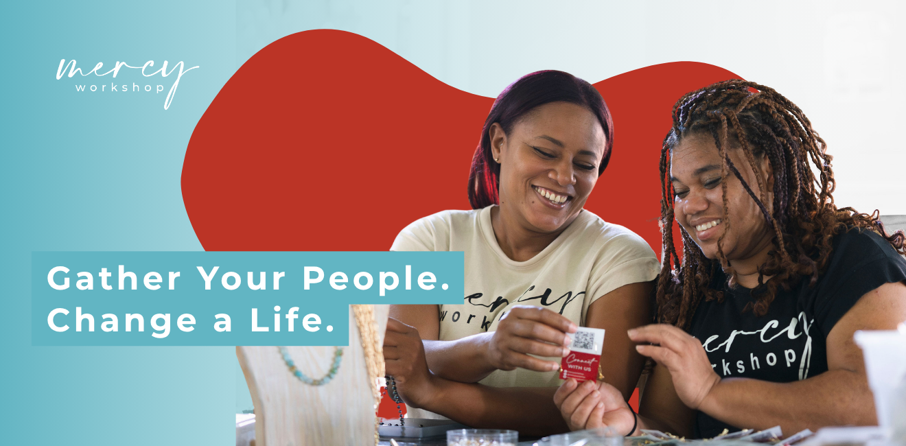 Gather Your People. Change A Life. Two women looking at jewelry tag smiling