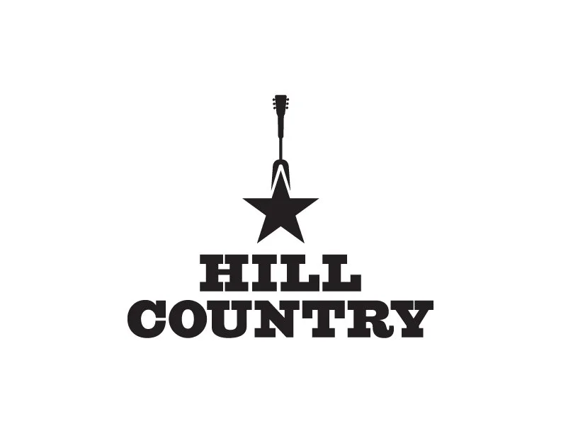 A black star with a guitar neck and headstock hanging above it, and the words "HILL COUNTRY" written below the star.