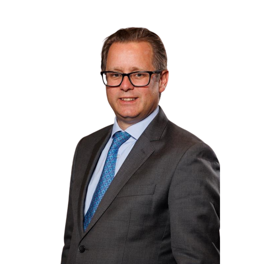 Headshot of Jack. A white male with a blue shirt and tie with a grey suit jacket, black rimmed glasses and dark blond hair
