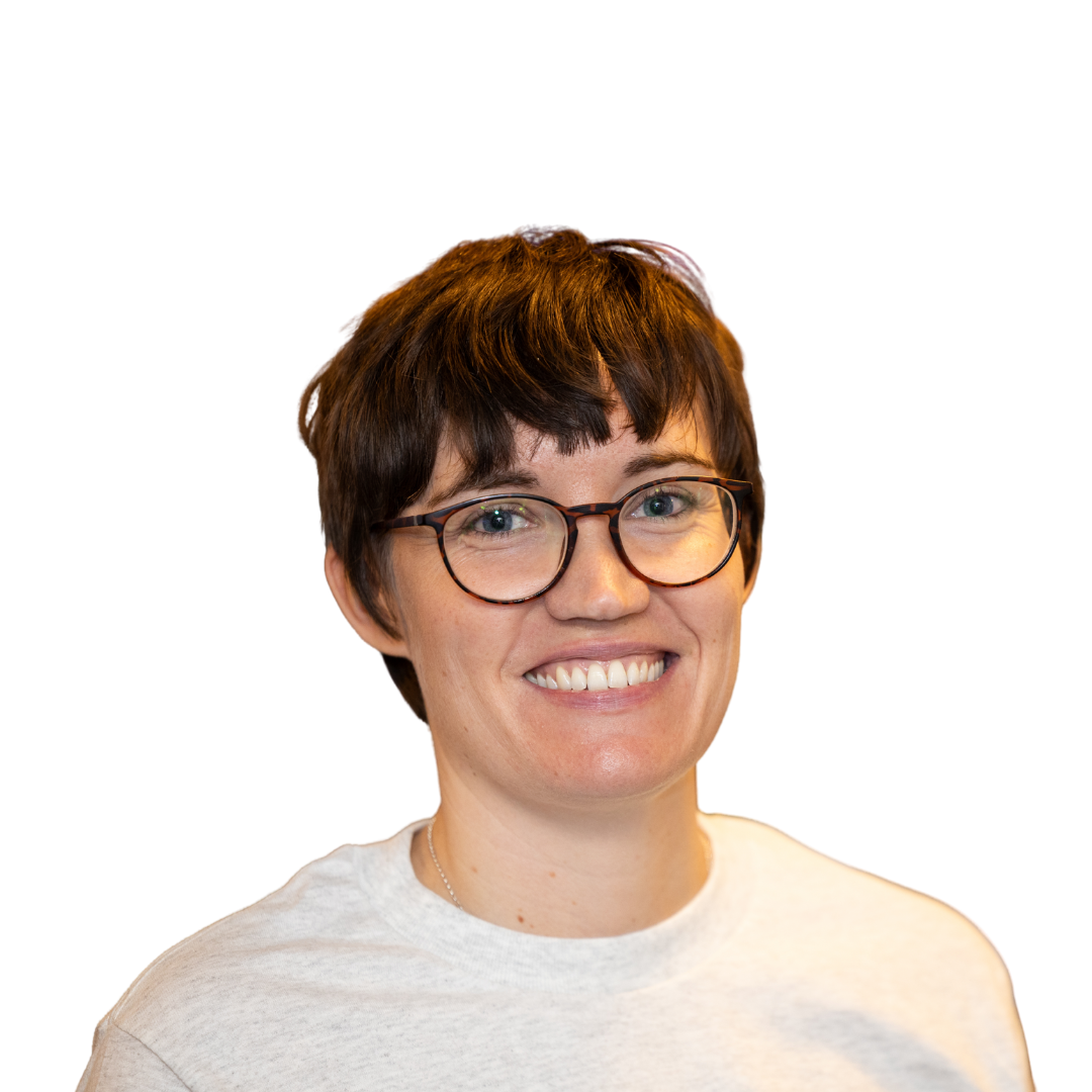 Headshot of Charlotte Hallas, A white female with short brown hair wearing glasses