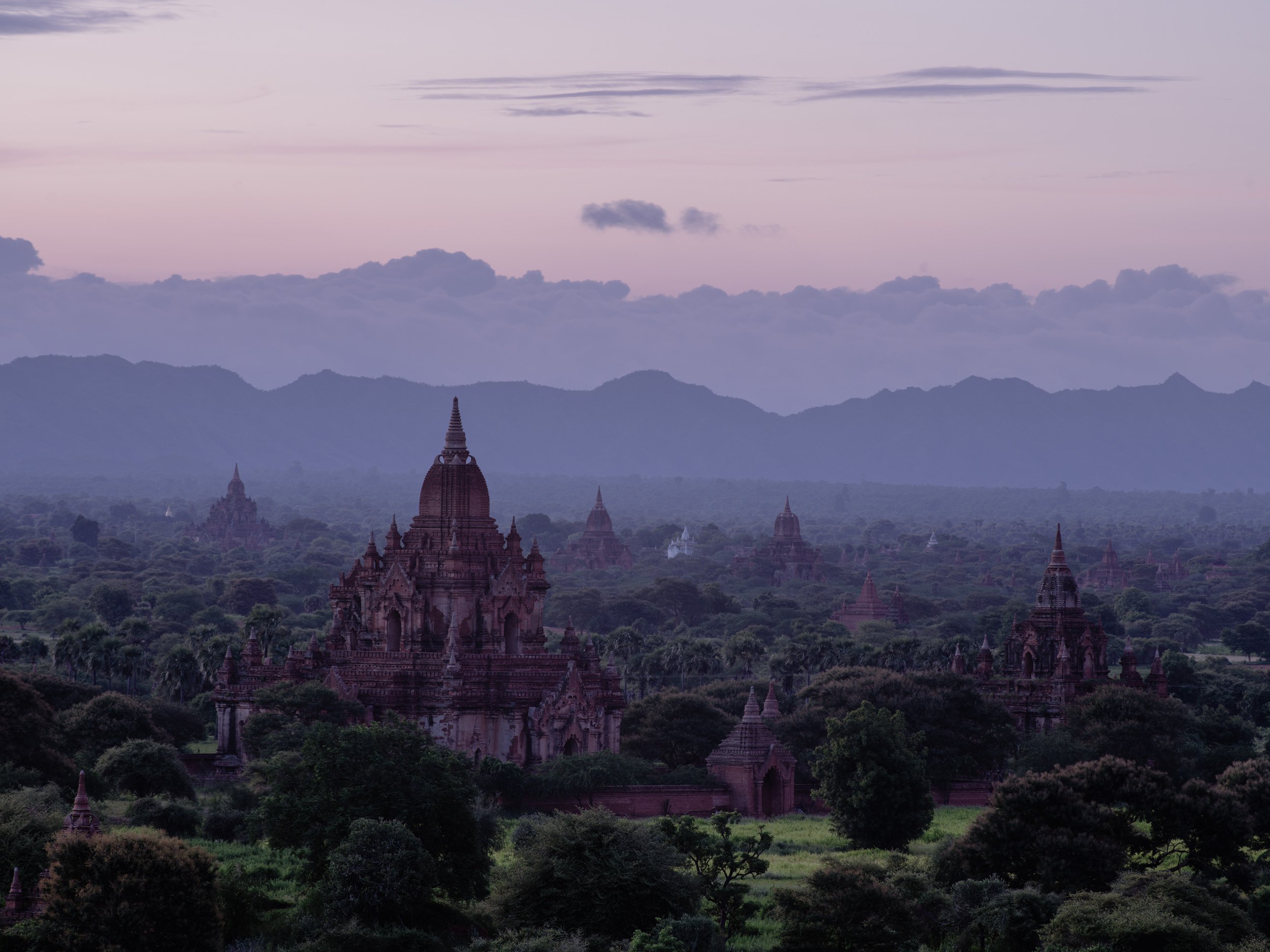 Misty sunrise over ancient Bagan temples and pagodas in Myanmar.