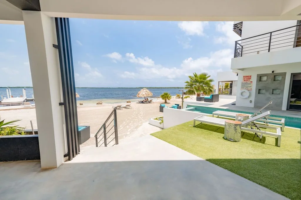 POOL AND BEACH VIEW OF AMBERGRIS CAYE