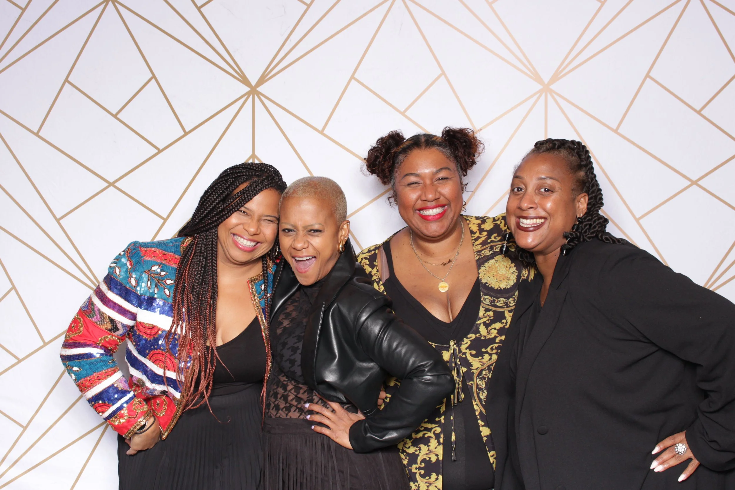 Friends posing with oh snap memories photobooth in downtown richmond, virginia