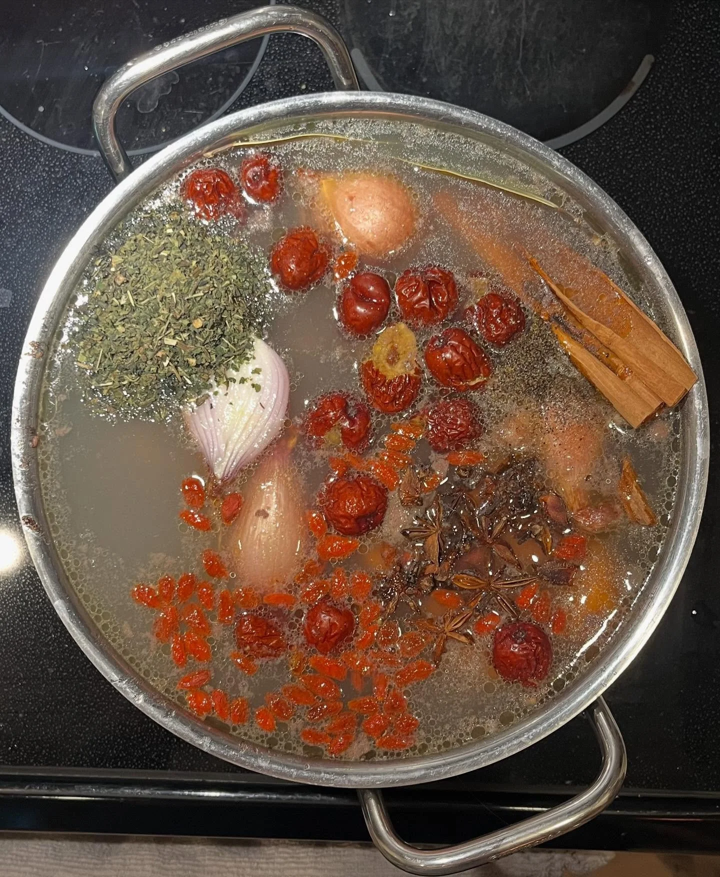 Today&rsquo;s pot is simmering with whole cinnamon, cloves, star anise, ginger, onion, salt, and pepper &mdash; bones from grass-fed cattle, chicken feet, and a handful of nettle, red jujube dates, and goji berries. Deeply inspired by @blissfulwombca