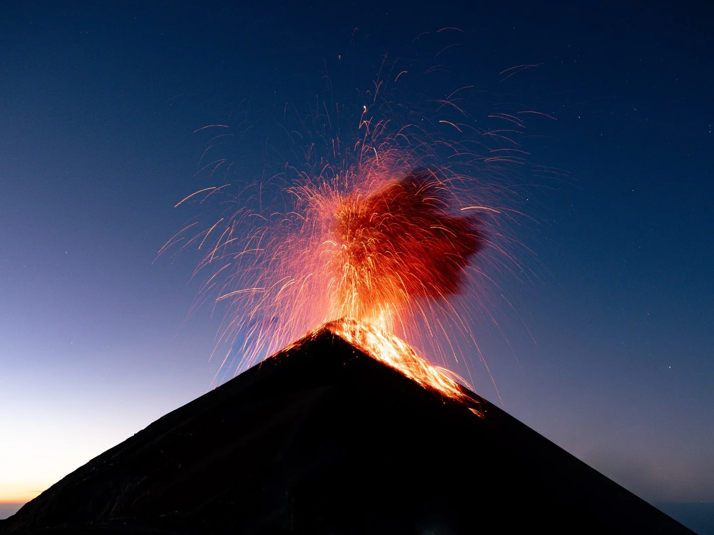Sunrise photo of Fuego volcano standing 600 meters from the crater