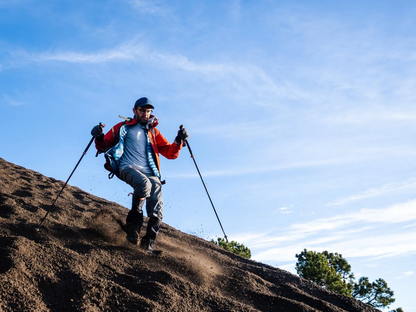 Hiker coming down from Acatenango volcano after the sunrise hike