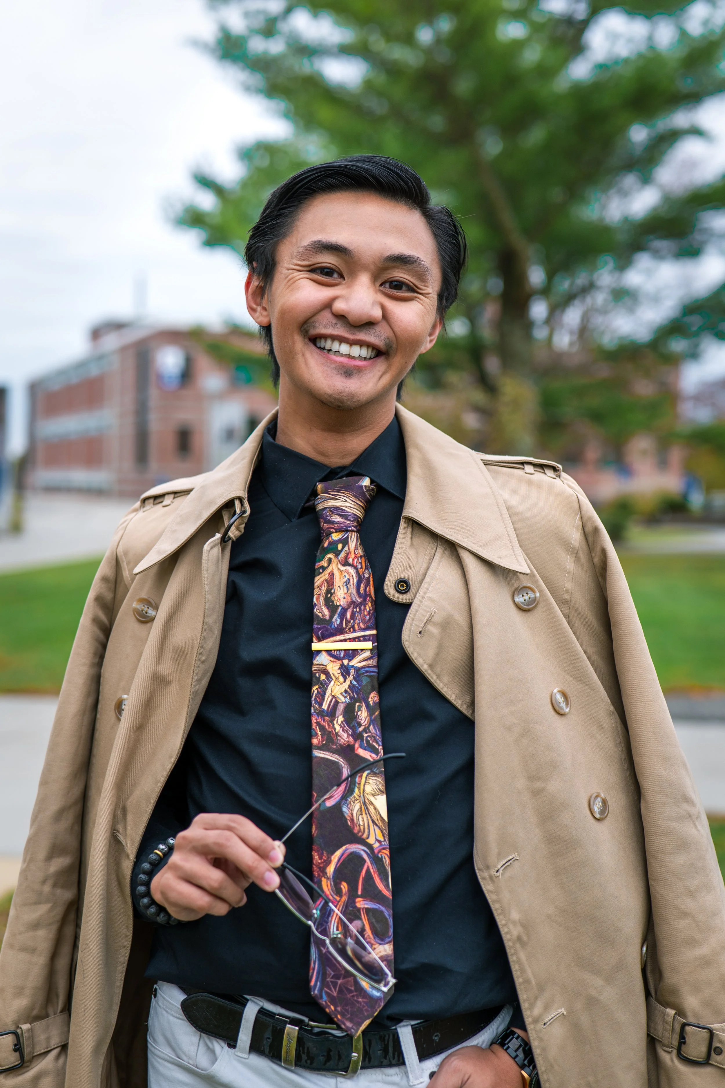 Nathan Magno smiling. Professional headshot.