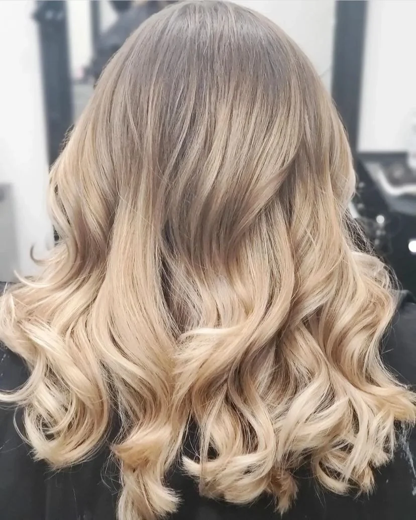 Soft blonde ombre waves seen from behind