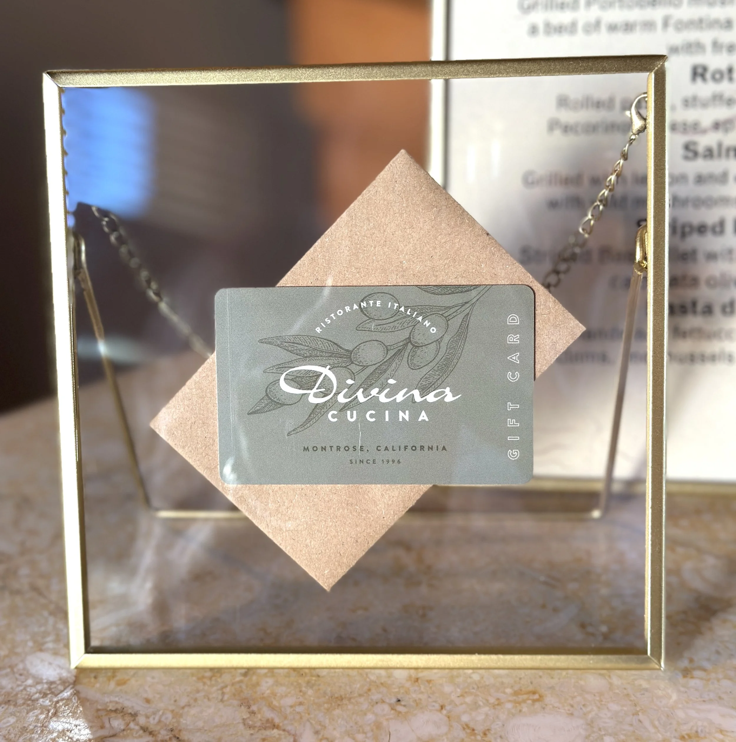 Gift card displayed in a gold frame