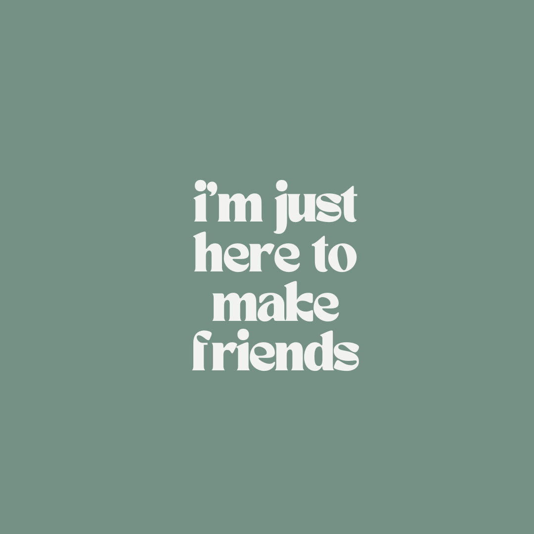 White stacked lettering on green reads: i’m just here to make friends.