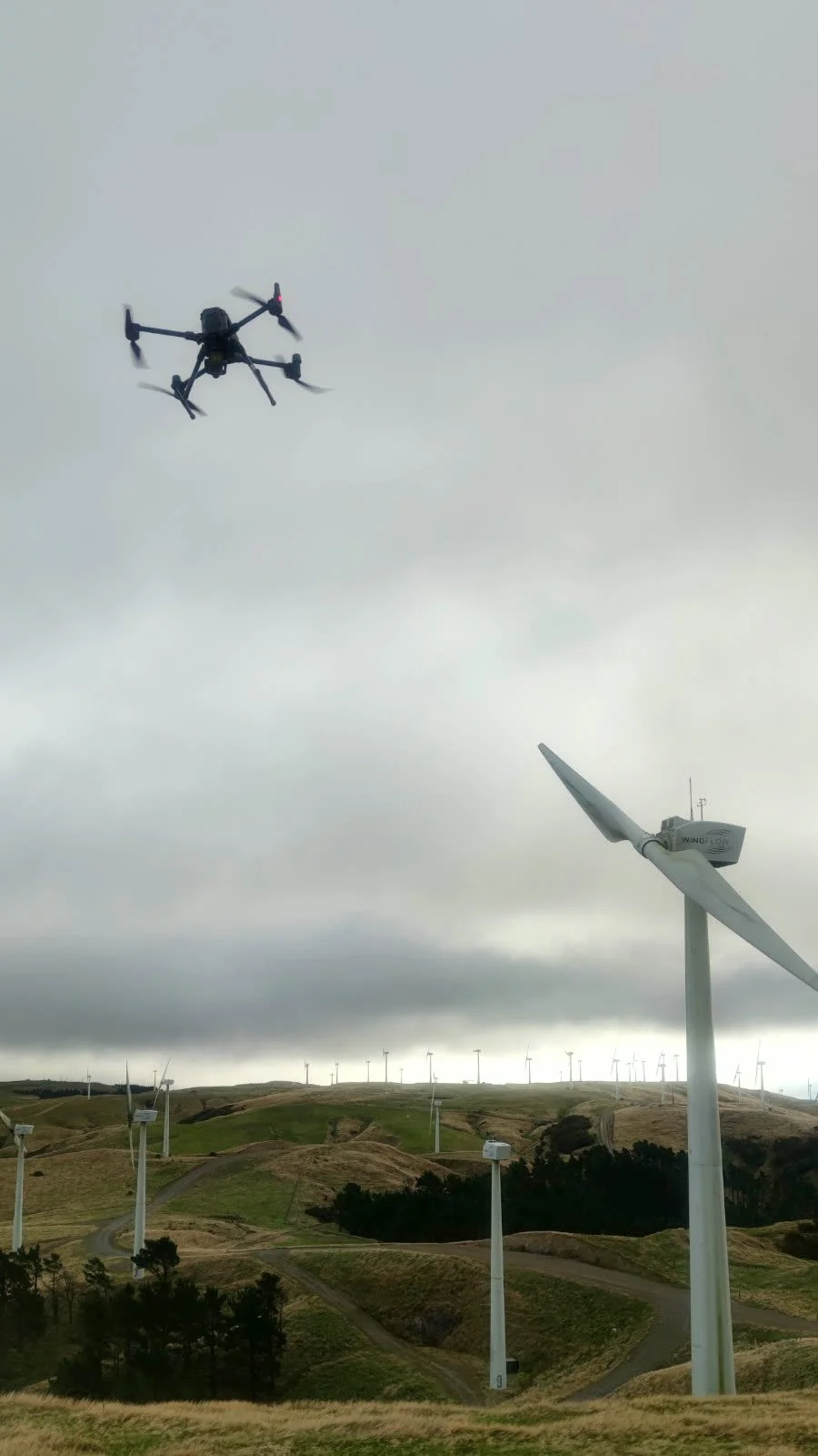 DJI Matrice 300 RTK drone flying a wind turbine inspection at a New Zealand wind farm