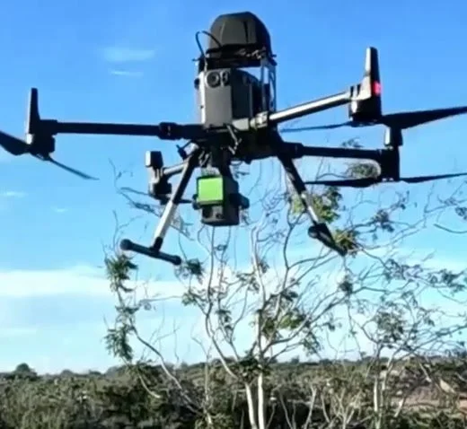 DJI Matrice 300 RTK drone in flight with parachute system and Zenmuse L2 LiDAR payload