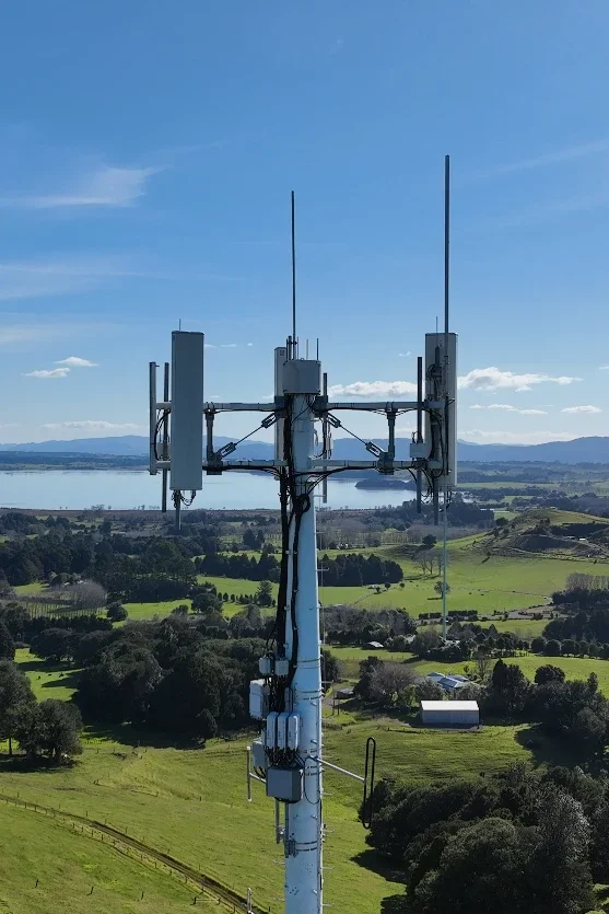 Drone view of a cell tower with antennas and mounting equipment, New Zealand
