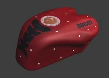 Red Ducati motorcycle fuel tank with black and gold accents, featuring company logo and branding.
