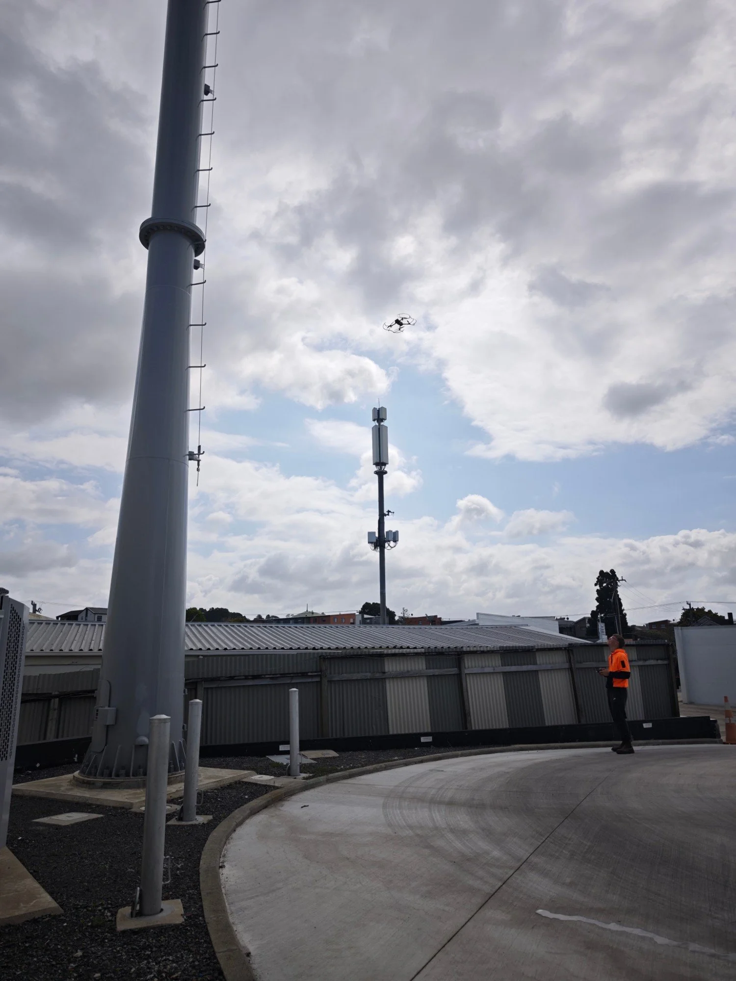 Recon pilot flying a DJI Mavic 3 Enterprise drone to inspect a cell tower