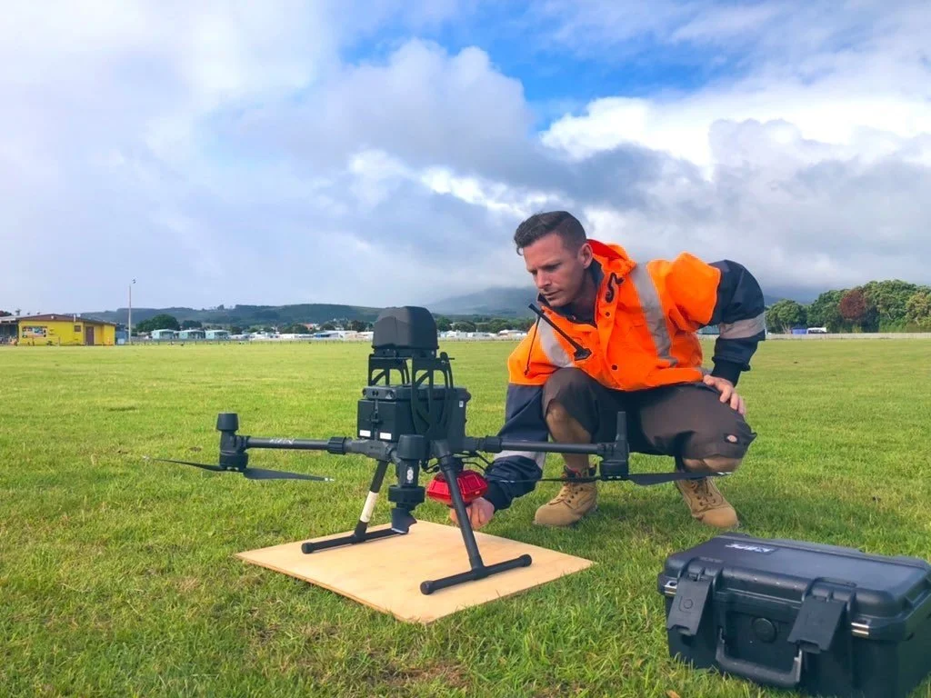 Recon pilot preparing a DJI Matrice 300 RTK drone with parachute system for an inspection flight