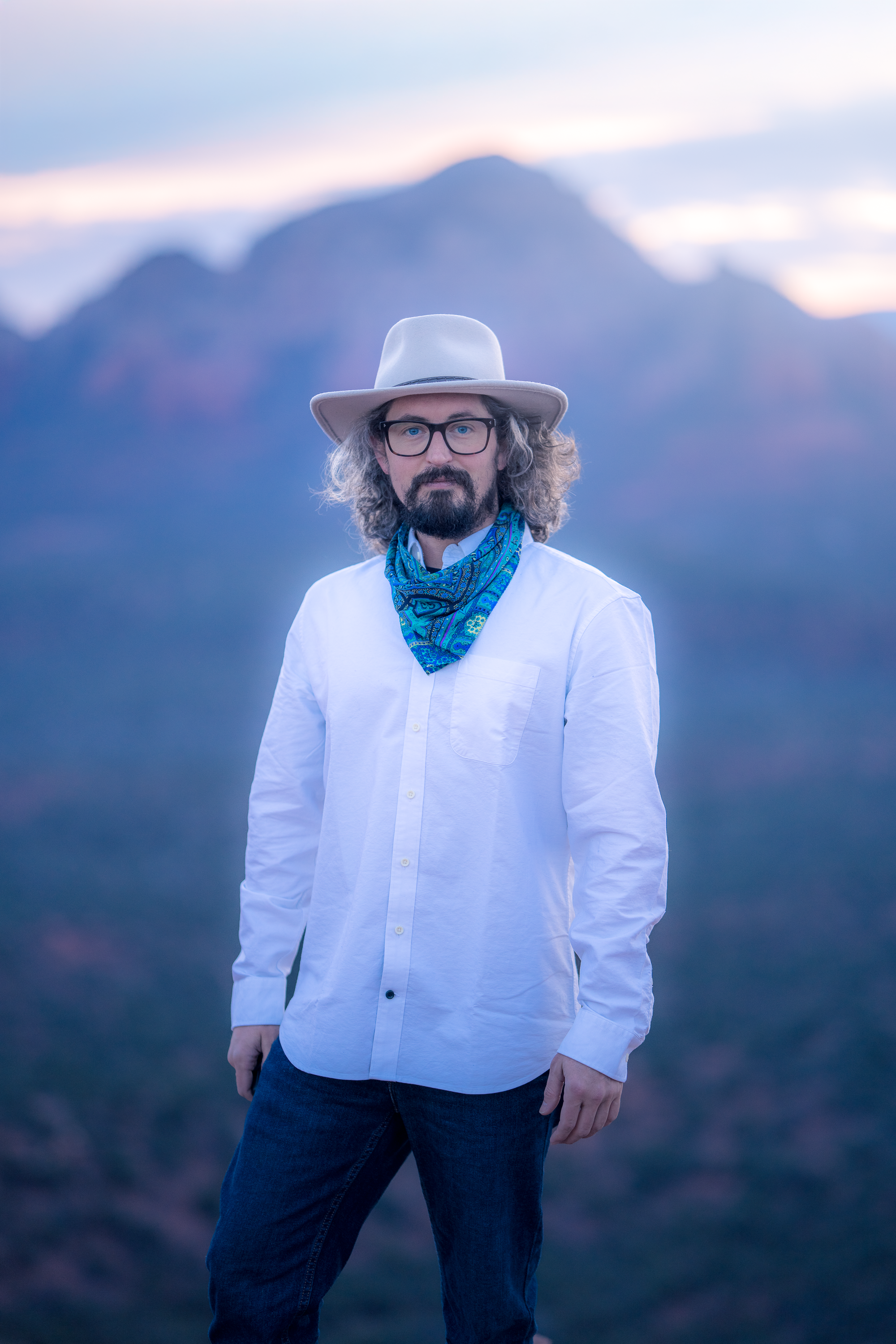 Self portrait of Archie Carmel at sunrise with a soft blue morning bokeh background of Sedona Arizona