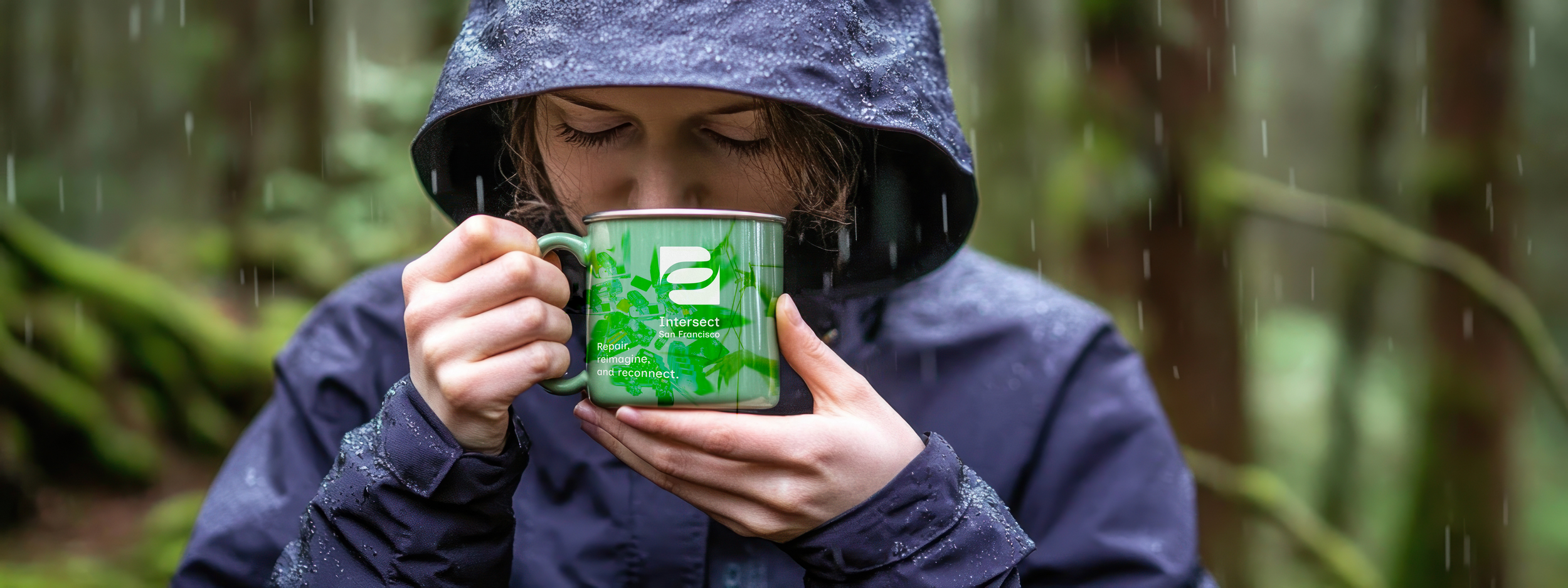 mug in woods holding in hands.png
