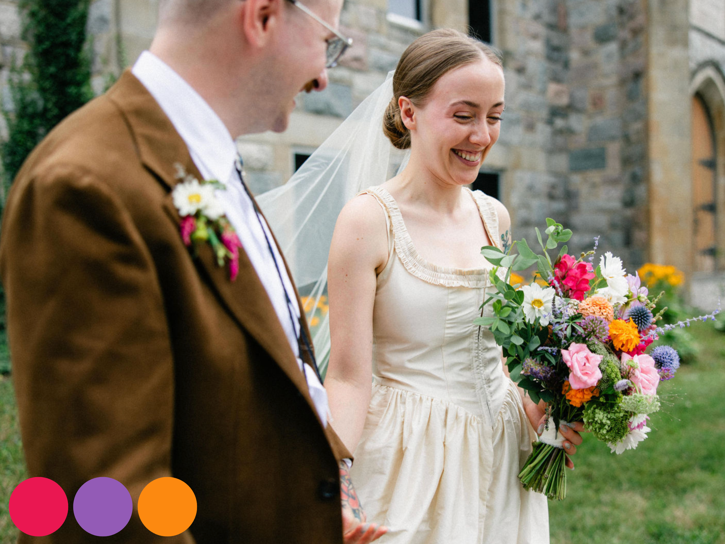 bride and groom walking together with vibrant bouquet in shades of pink, orange, yellow, and purple, showcasing bright summer wedding flowers in a colorful wedding flowers summer palette