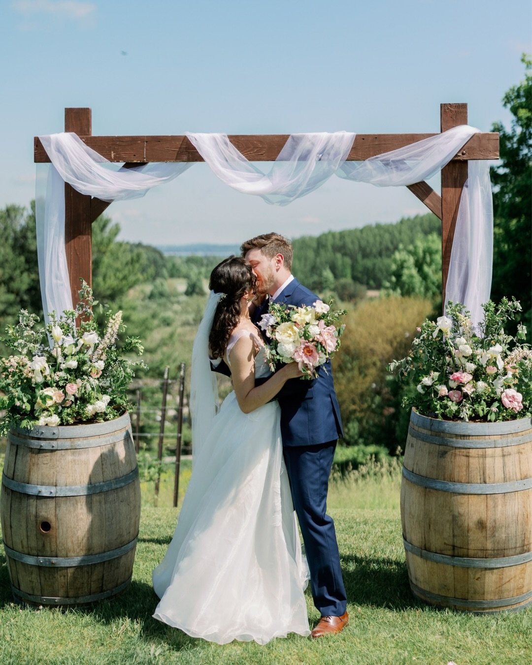 Megan &amp; Isaac&rsquo;s early June wedding at Black Star Farms felt like that perfect in-between moment when spring is starting to give way to summer. Soft blush, creamy white, pale blue and fresh green set the palette, with peonies, iris, tulips a
