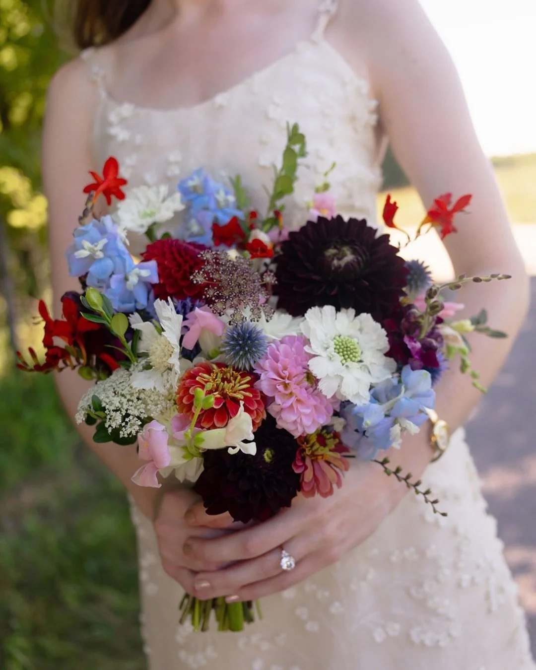Margaret &amp; Sam&rsquo;s wedding felt a little like stepping into a film.

Their inspiration leaned Wes Anderson: rich reds, pale blues, deep burgundies and a color palette that felt nostalgic, unexpected and completely their own.

We carried those