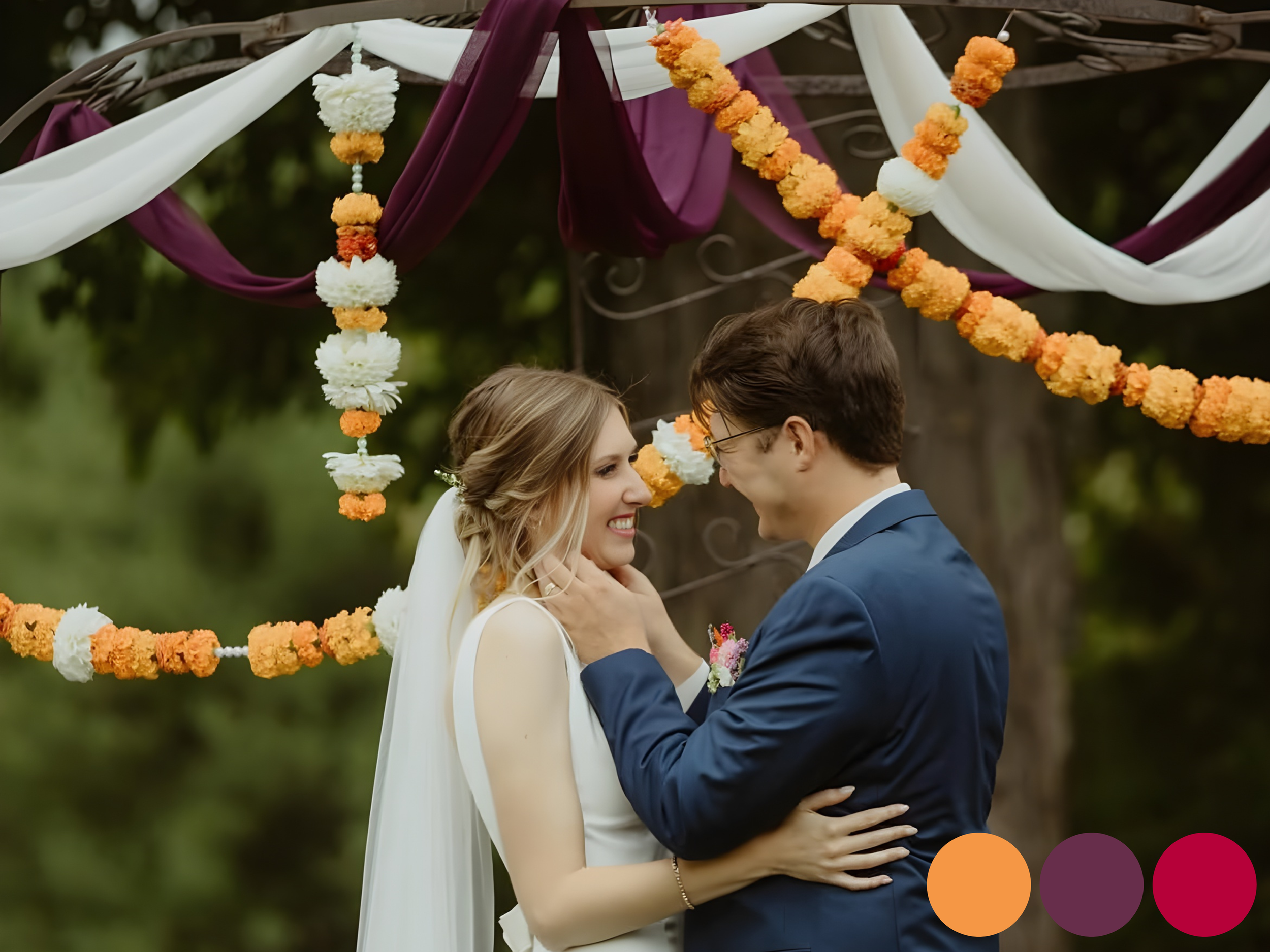 bride and groom standing beneath a marigold ceremony arch with orange and white floral garlands, showcasing early fall wedding flowers with vibrant September wedding color palette and lingering summer tones