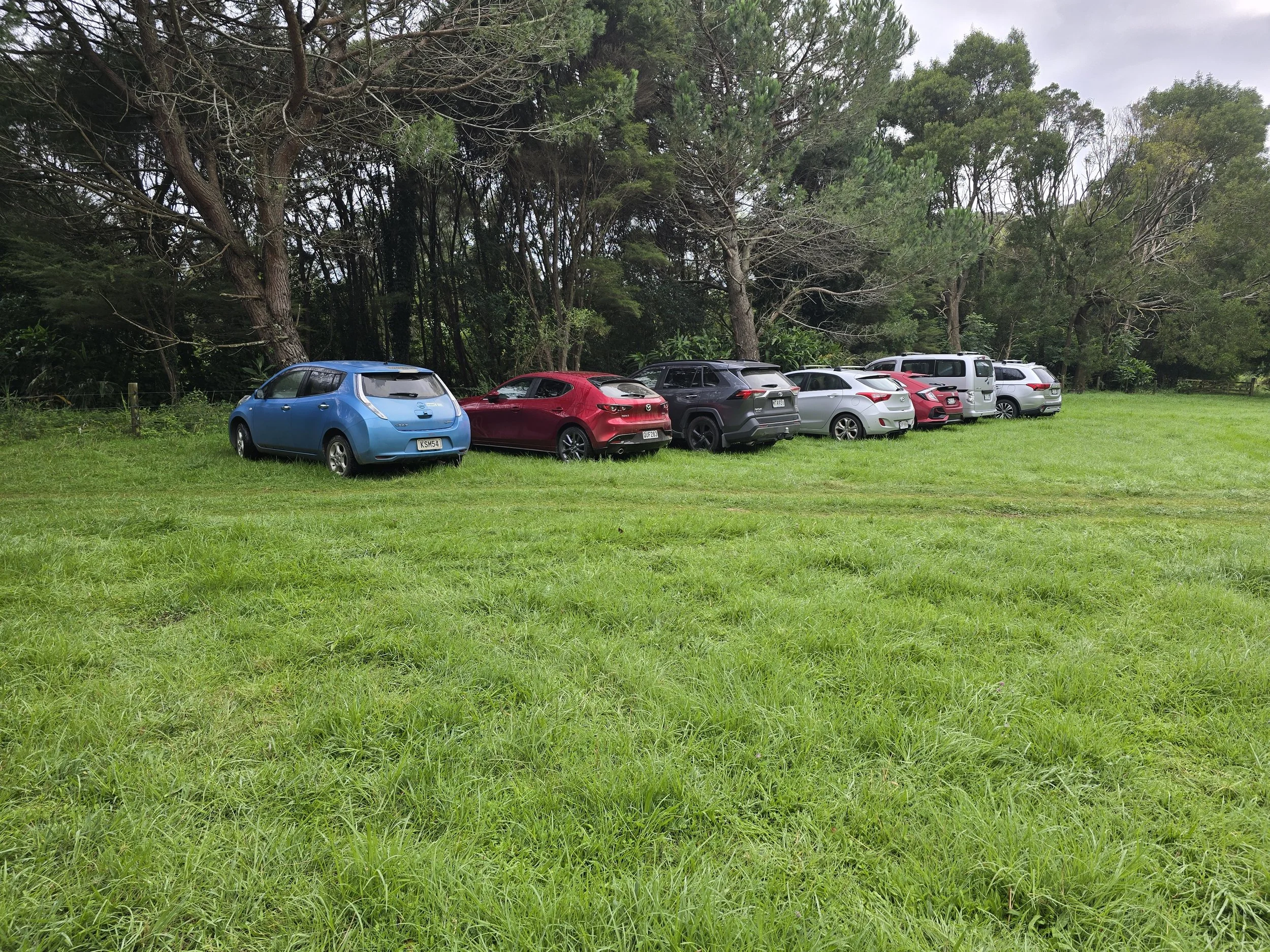 Cars parked away from the camping area