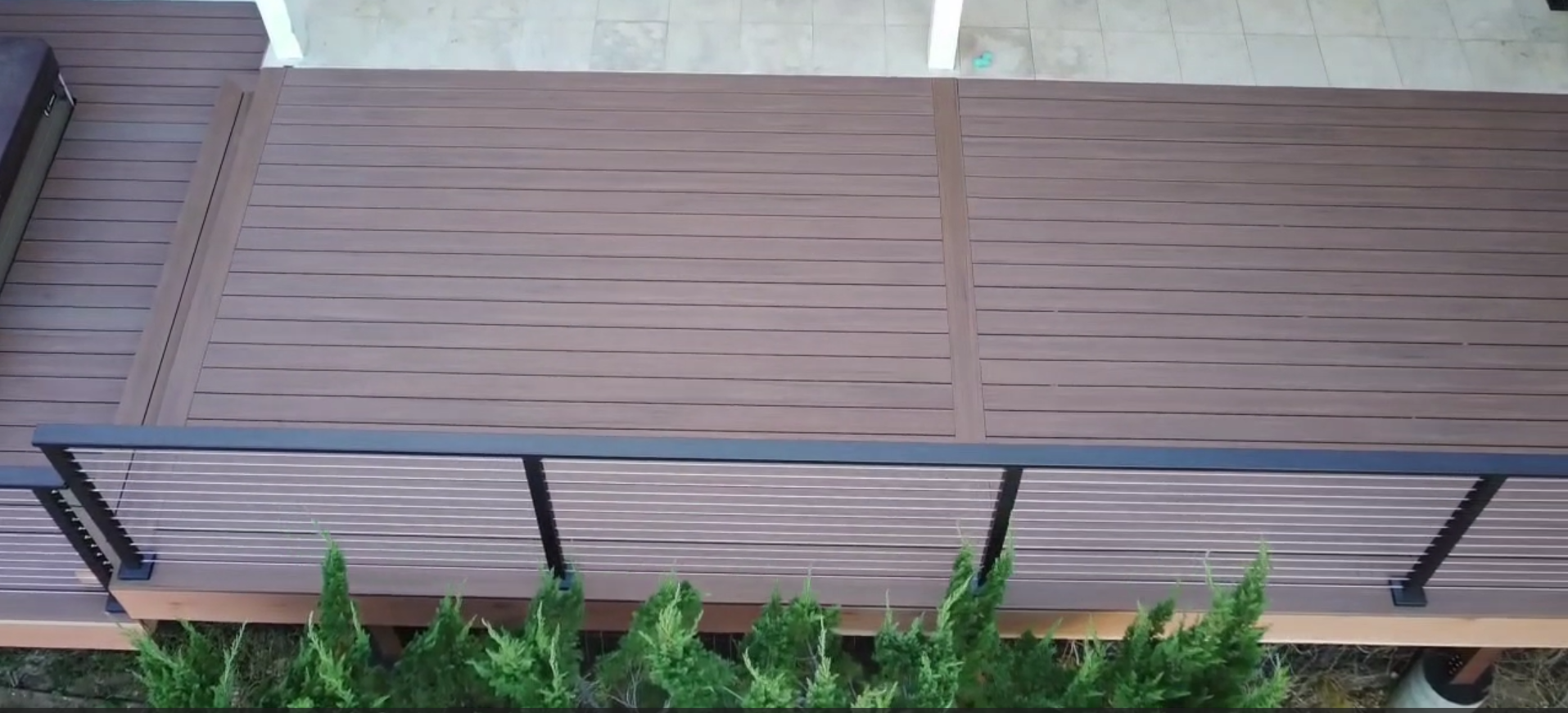 Newly rebuilt deck featuring upgraded composite decking boards and modern guardrail system designed for long-term durability.