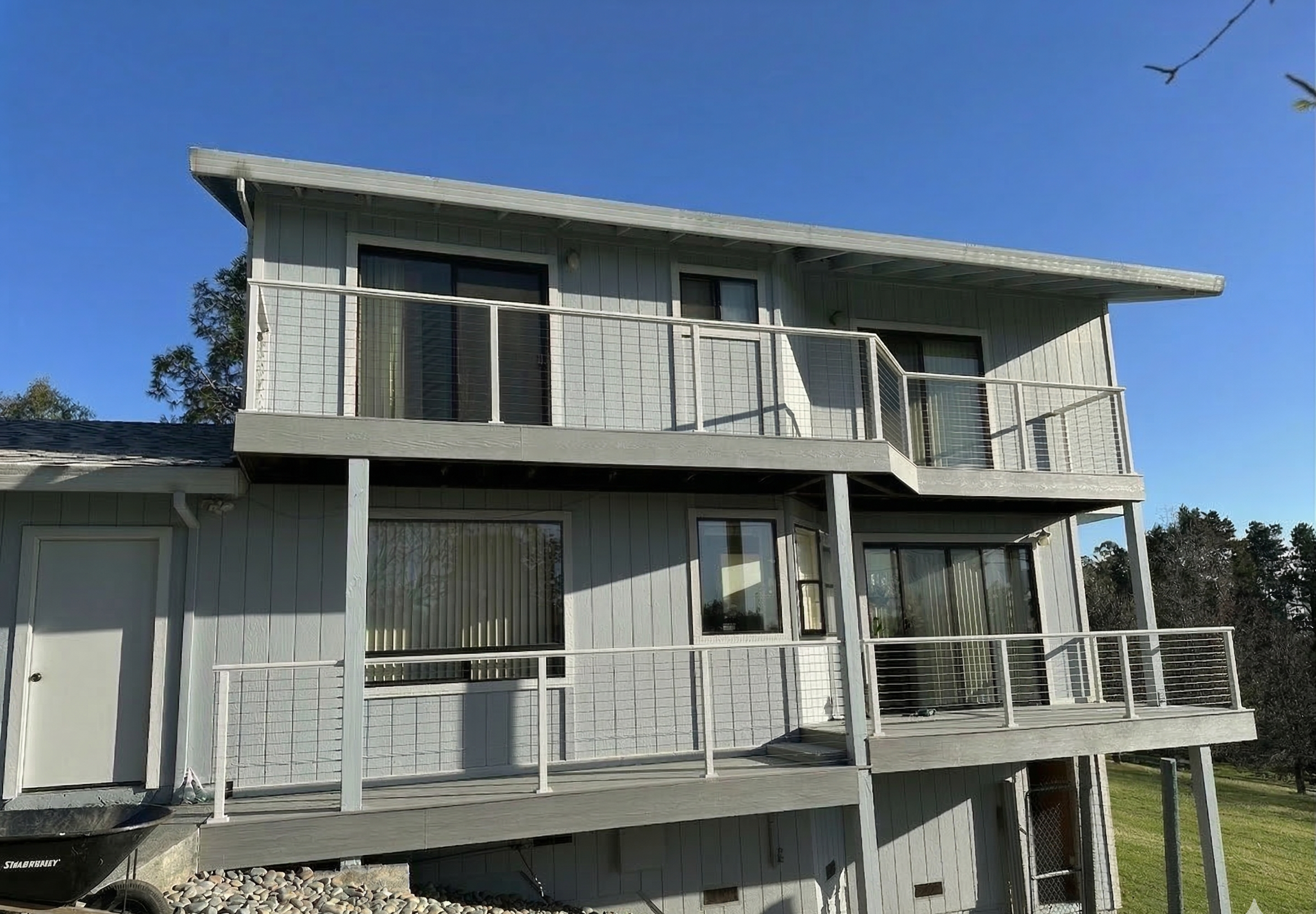 Existing deck being remodeled with updated framing, decking replacement, and modern railing integration.