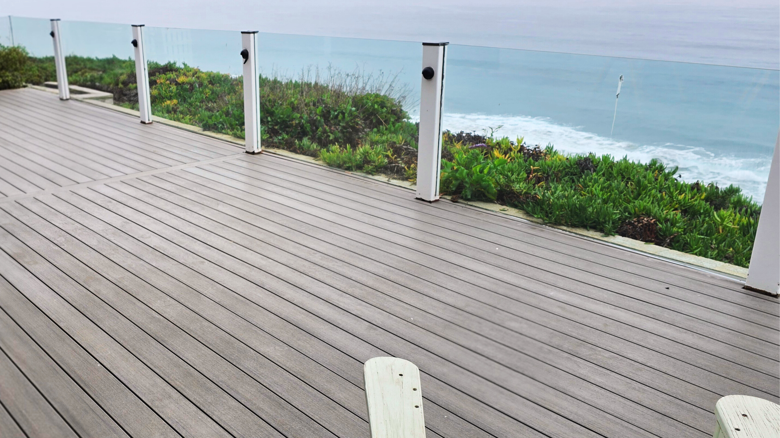 Coastal Encinitas project featuring Advanced PVC decking in a multitonal grey finish. This high-performance, 100% synthetic material is engineered for total moisture resistance and salt-air durability on the California coast.