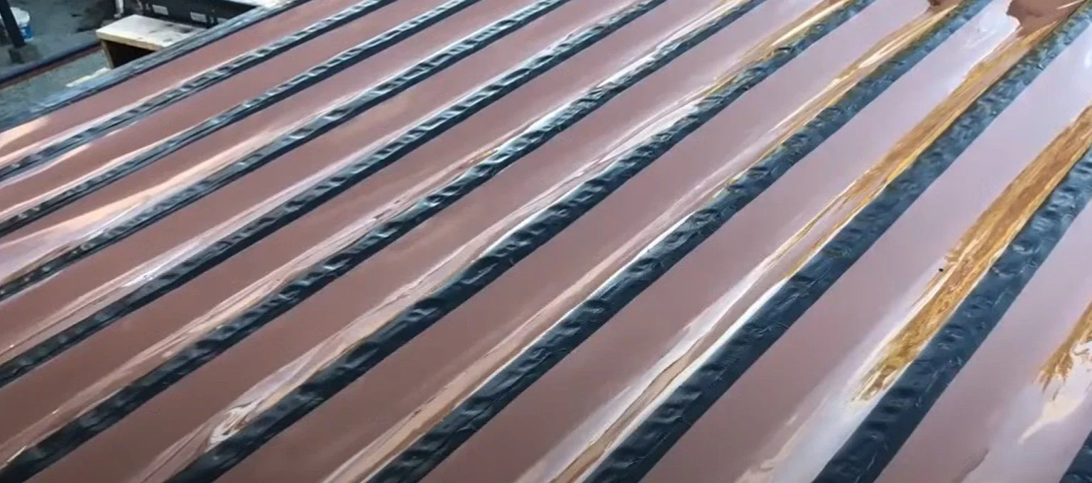 Trex RainEscape deck drainage system installation for moisture-protected under-deck living space.