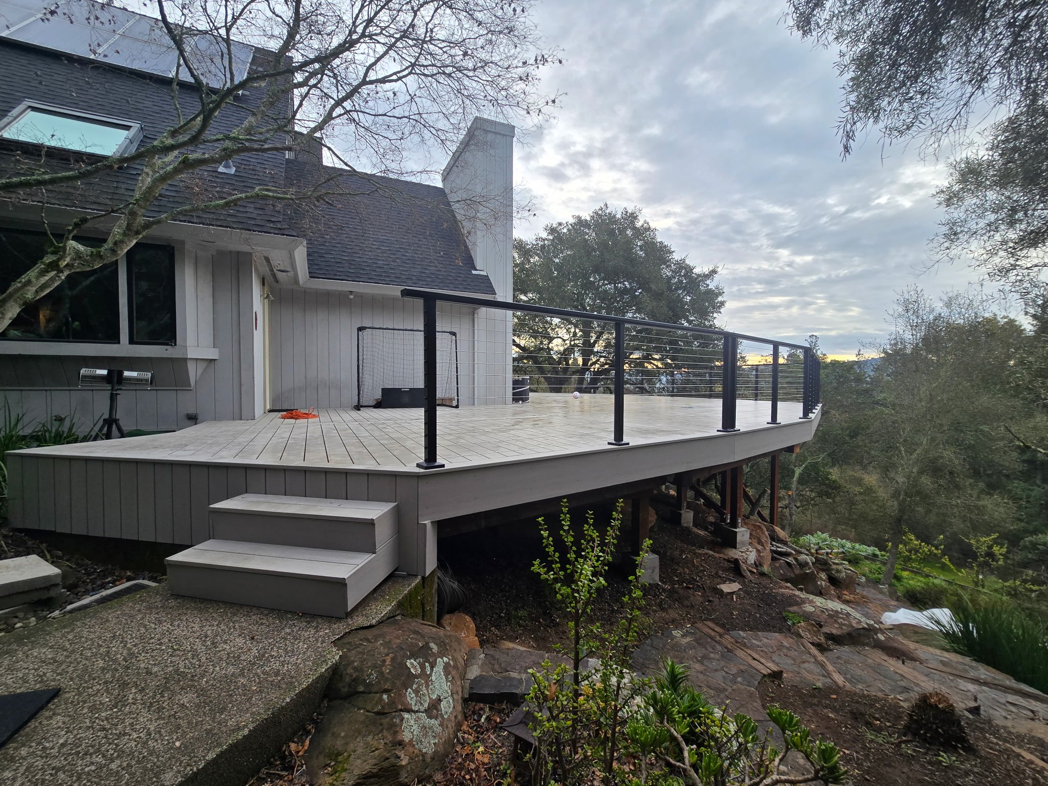Large custom AZEK advanced PVC deck installed by Picano Builders with Feeney cable railing, precision board layout, and expansive outdoor living space designed for moisture resistance and long-term performance.