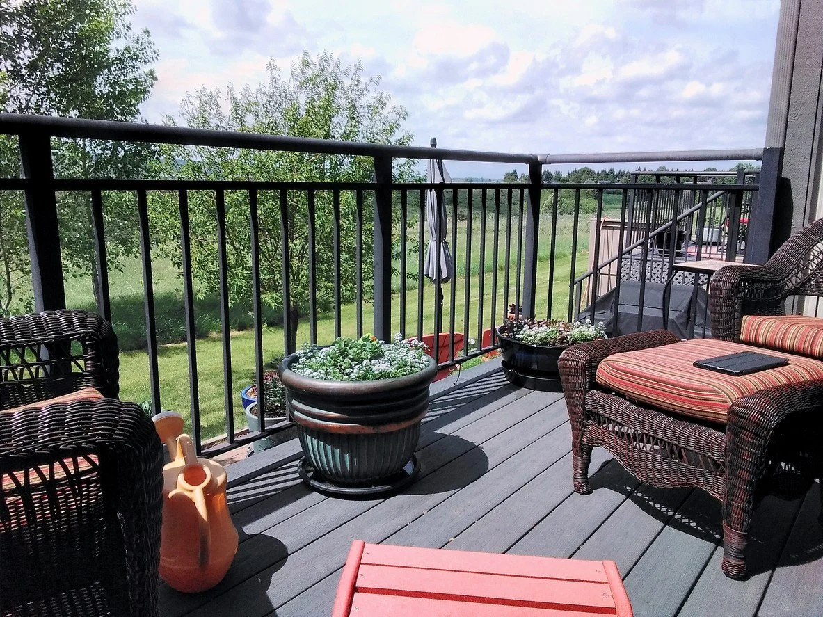 Modern powder coated aluminum railing installed on outdoor deck providing durable safety integration and contemporary architectural styling.
