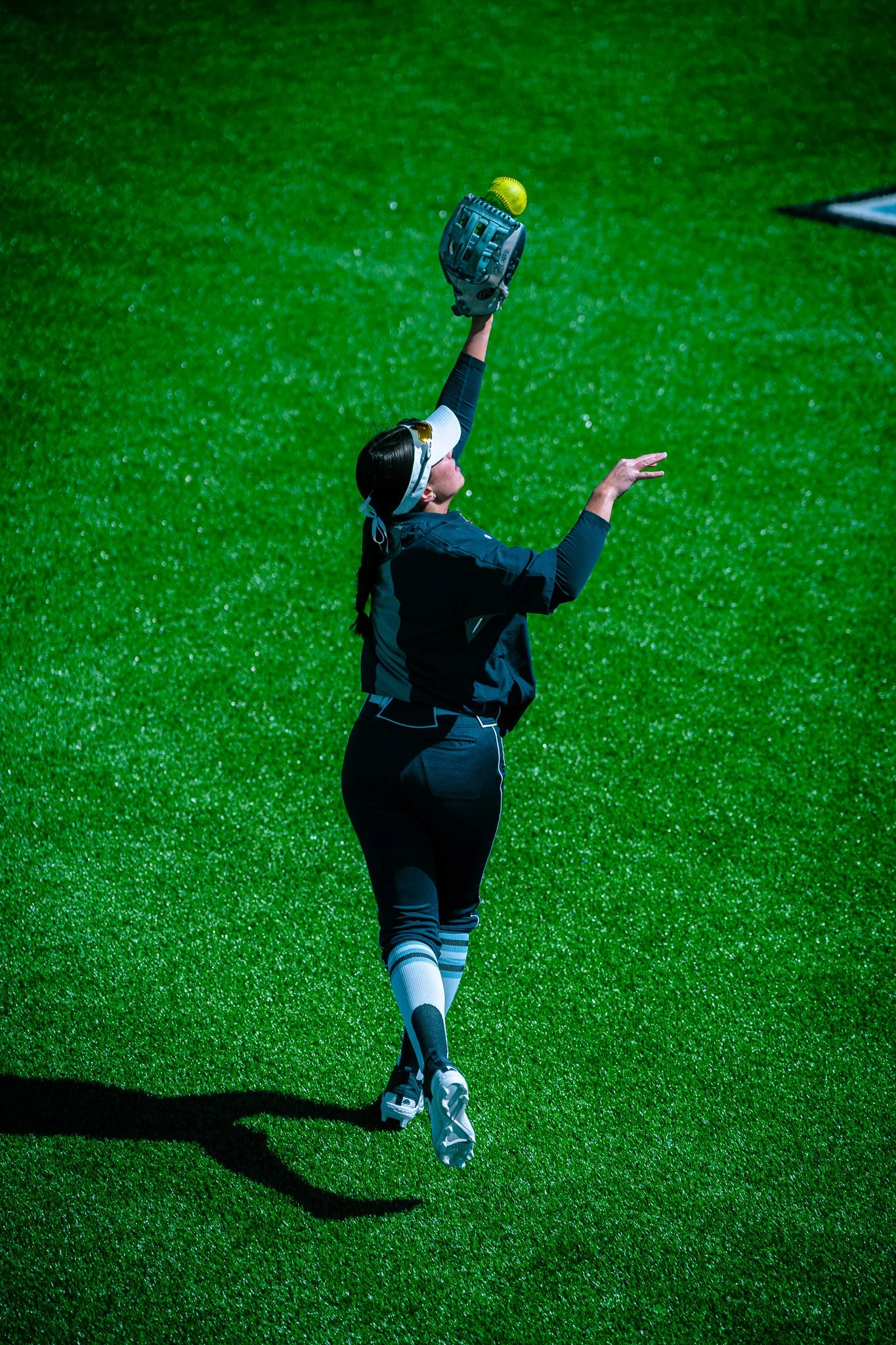 Softball player catching a ball