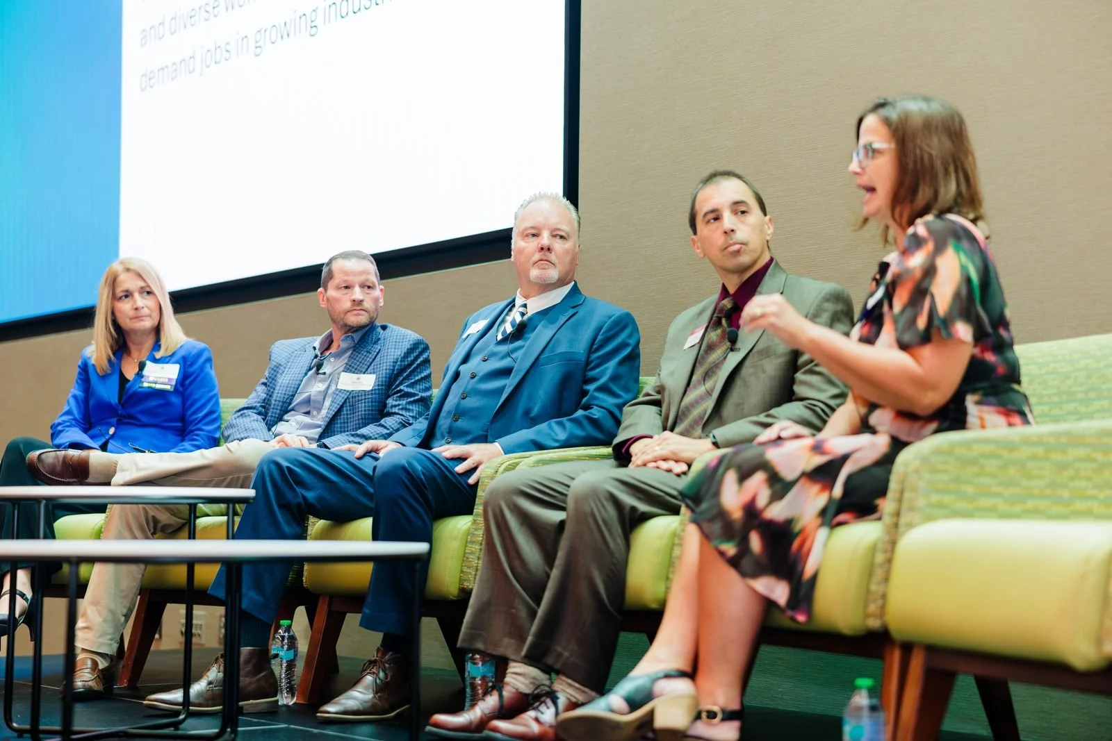 Economic Summit · Panelists exchange ideas on stage.