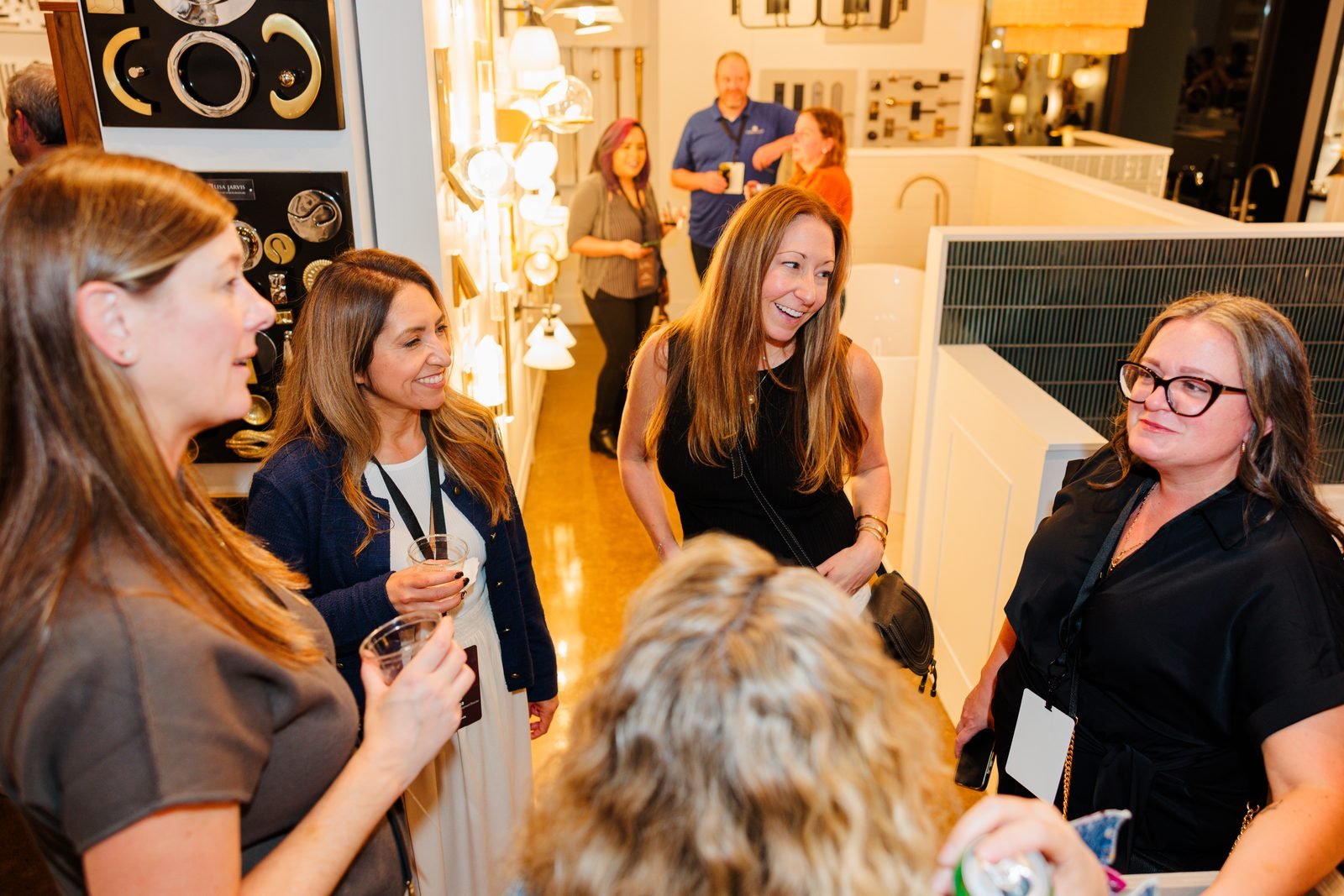 Forte Sales Summit 2026 · Attendees connect during a showroom reception.