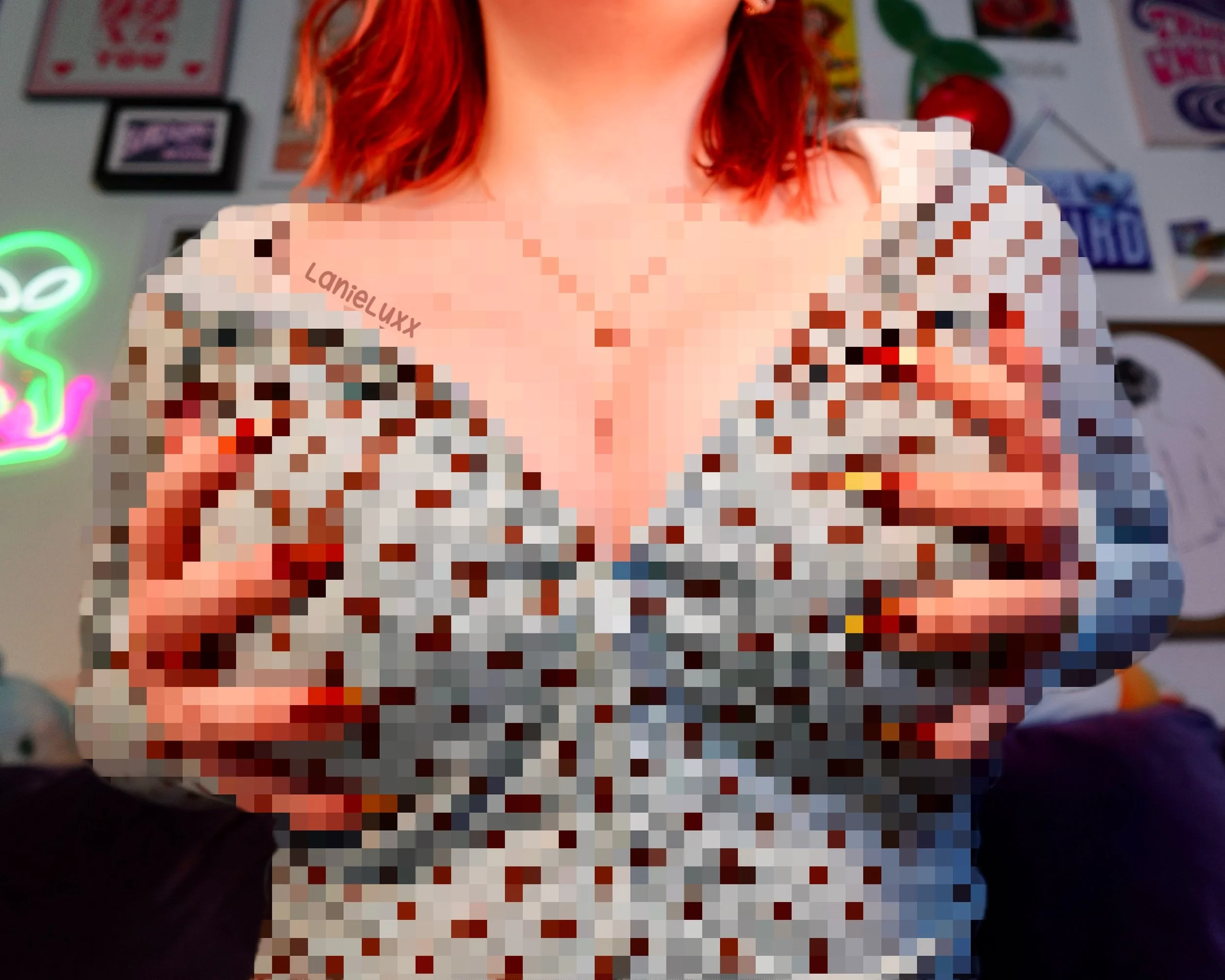 A person with red hair wearing a top with a polka dot pattern. The background includes posters and neon signs on the wall.