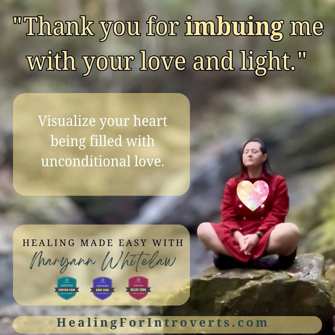 Woman in red coat meditating on rock. Energetic shielding advice.
