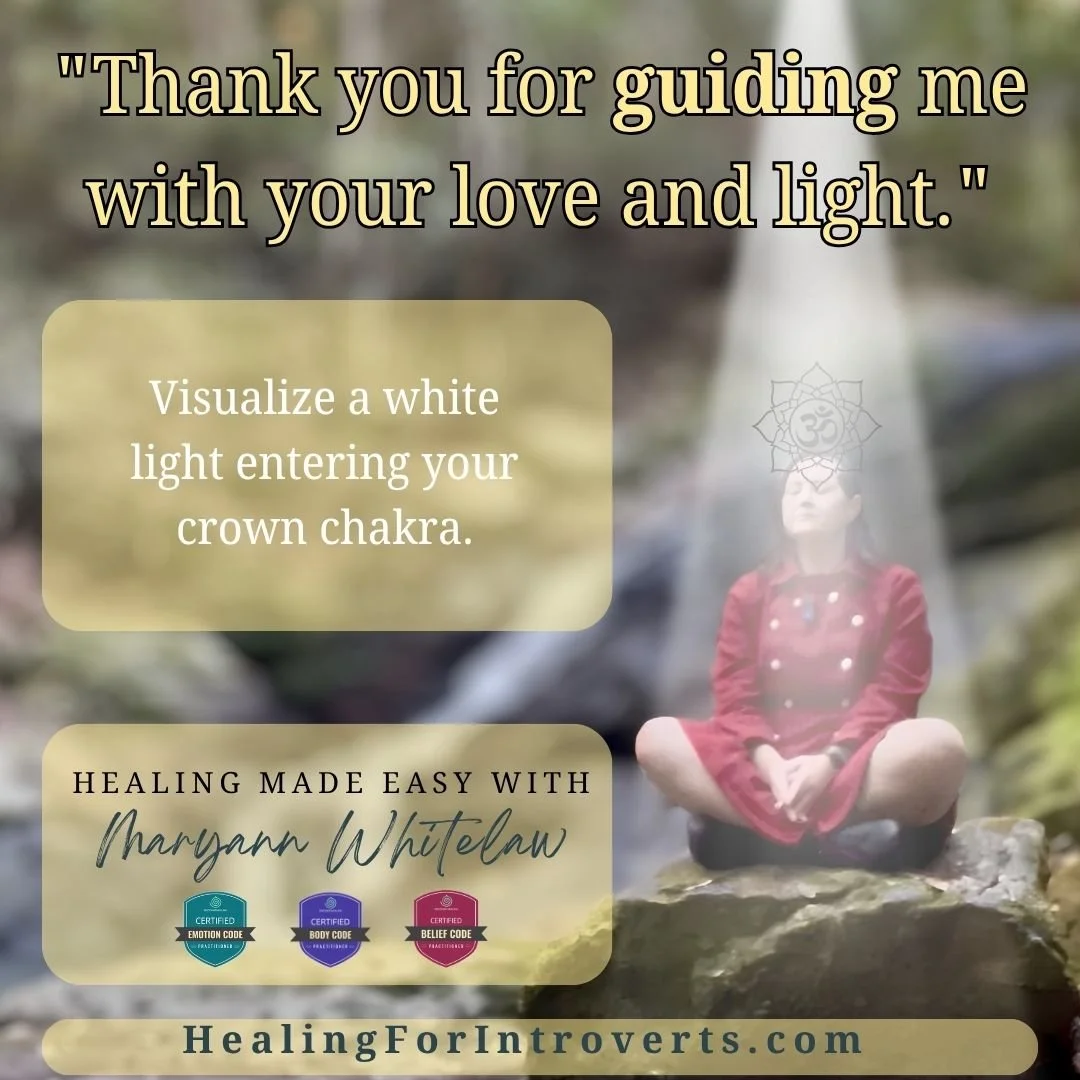 Woman in red coat meditating on rock. Energetic shielding advice.