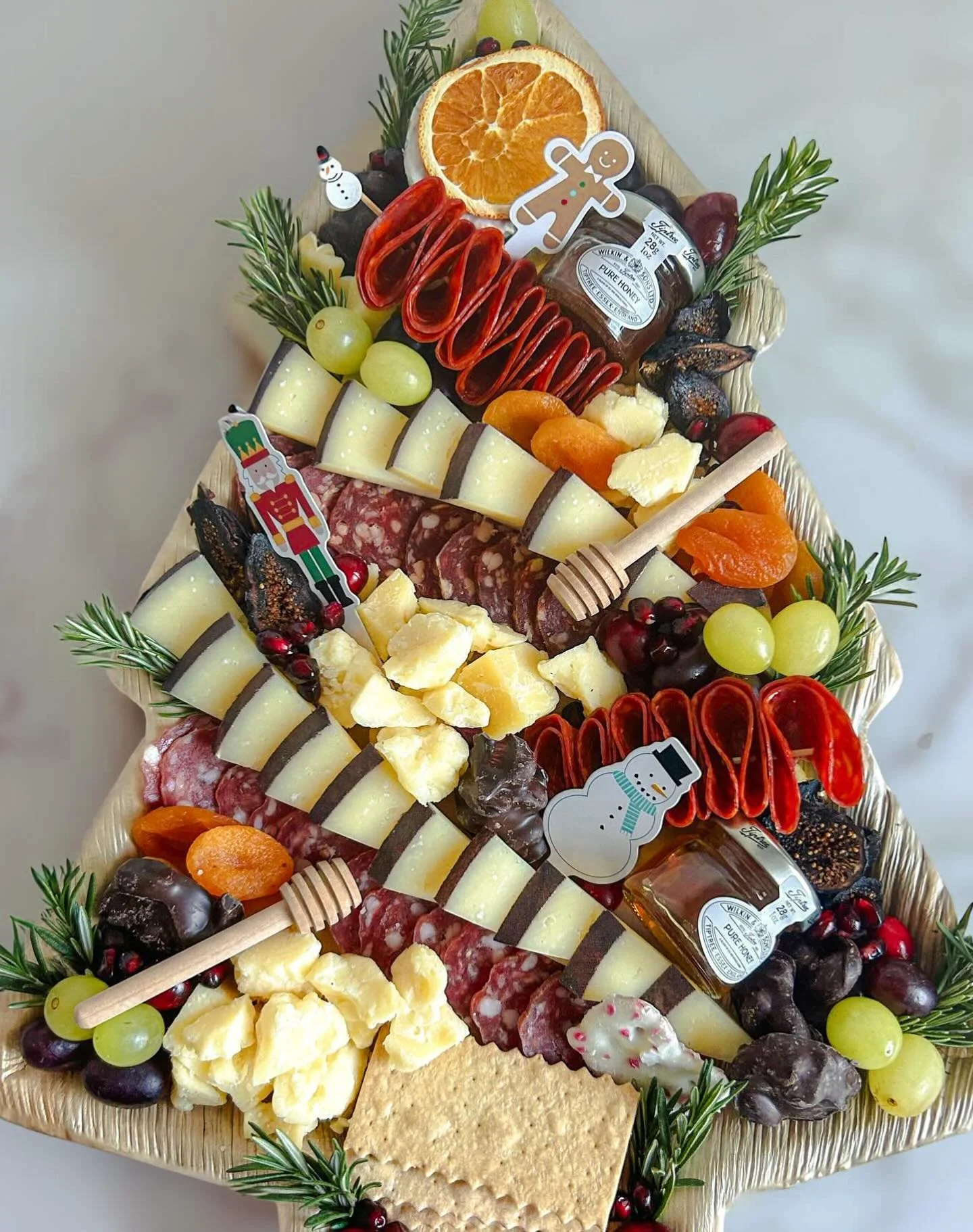 Our Holly Jolly Tree is back for the holidays! 🎄 Pre-order any festive tray, board or box online and pick up in store Thursday through Sunday.

Please note: Christmas Eve pre-order pickups will be available from 12 PM&ndash;2 PM only. We&rsquo;ll be