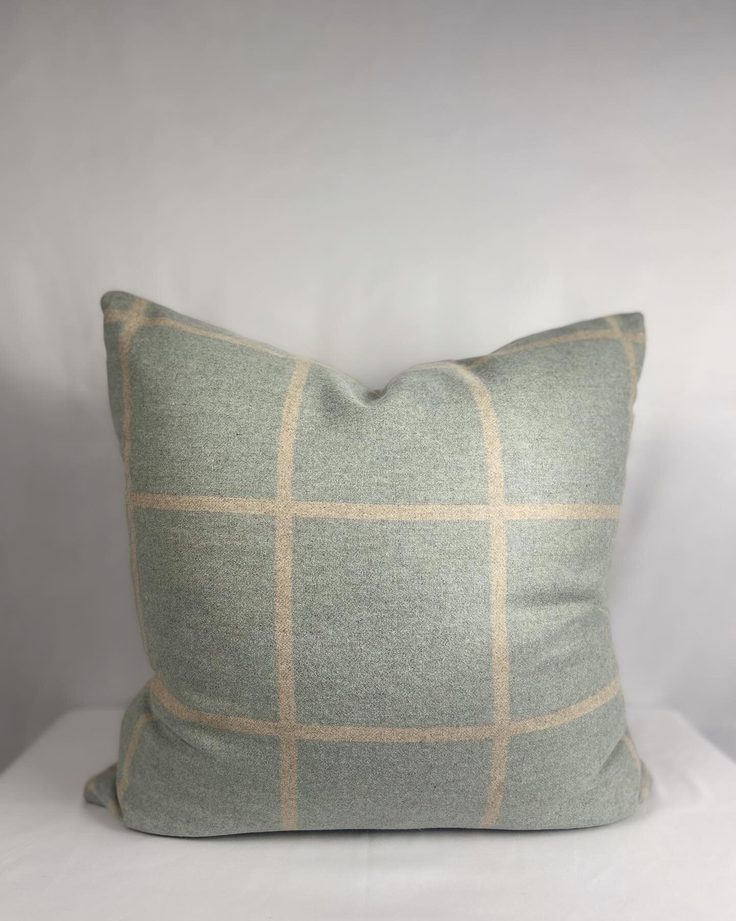 20x20 Powder blue and oatmeal, reversible, grid pattern, wool pillow, with a down alternative insert.