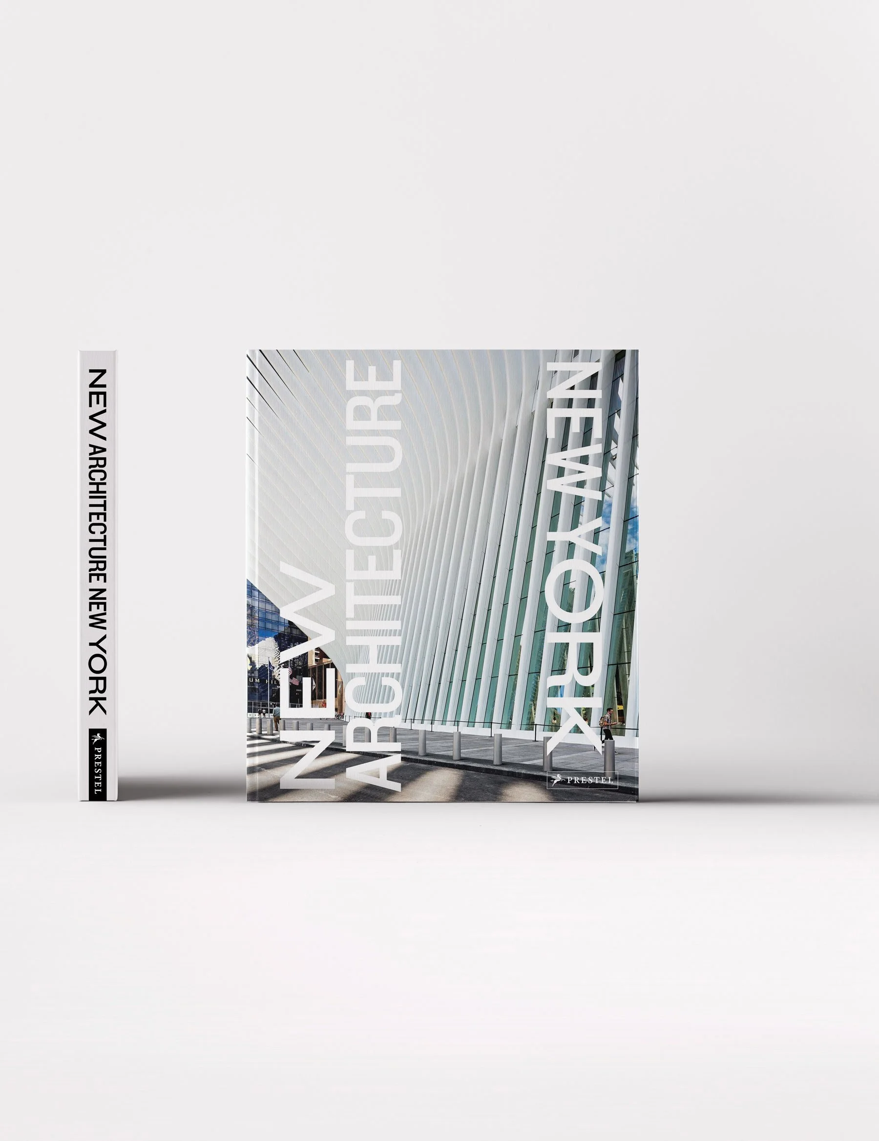 Book titled "New Architecture New York" with a covering photograph of modern architectural building featuring white vertical lines and glass panels.