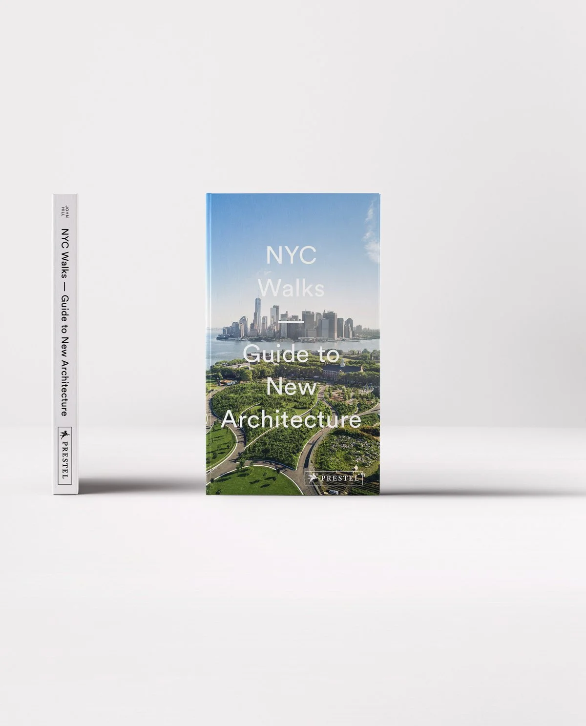 Book titled 'NYC Walks: Guide to New Architecture' featuring a city skyline and park view on the cover, with a white spine showing the title and publisher.