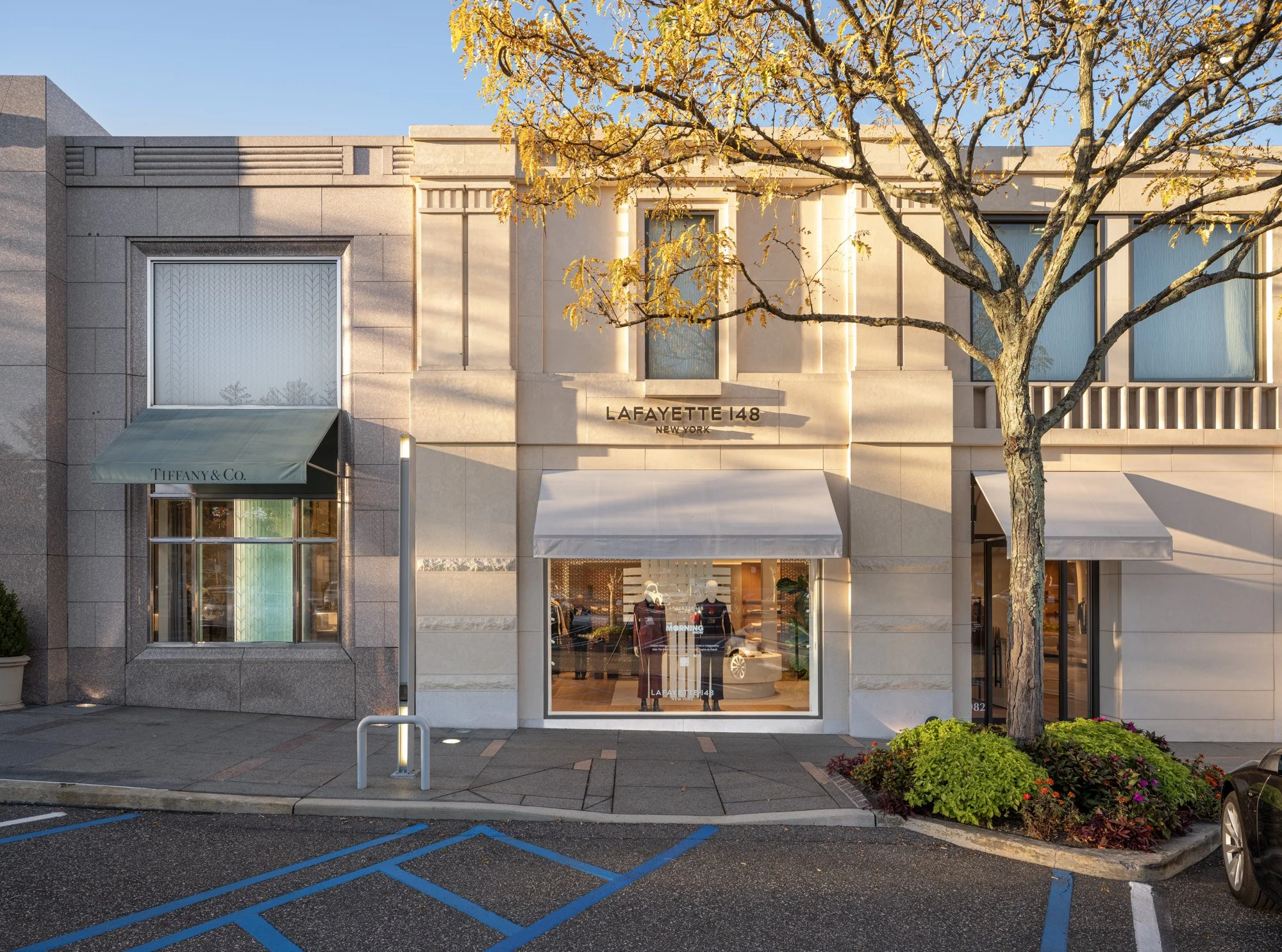 Luxury storefront facades at Americana Manhasset including Dior, David Yurman, Ralph Lauren, Fendi, Lafayette 148, Scanlan Theodore, LoveShackFancy and Todd Snyder — retail architectural photography across seasons by Pavel Bendov, Manhasset NY