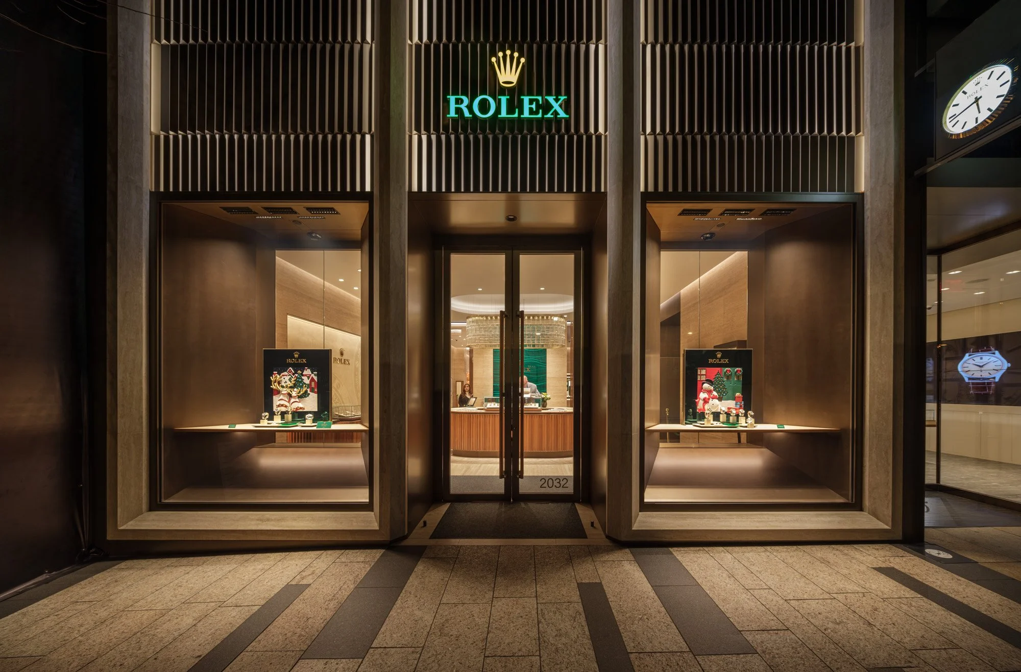 Versace and Rolex storefronts at Americana Manhasset photographed at golden hour and night — luxury retail architectural photography by Pavel Bendov, Manhasset NY