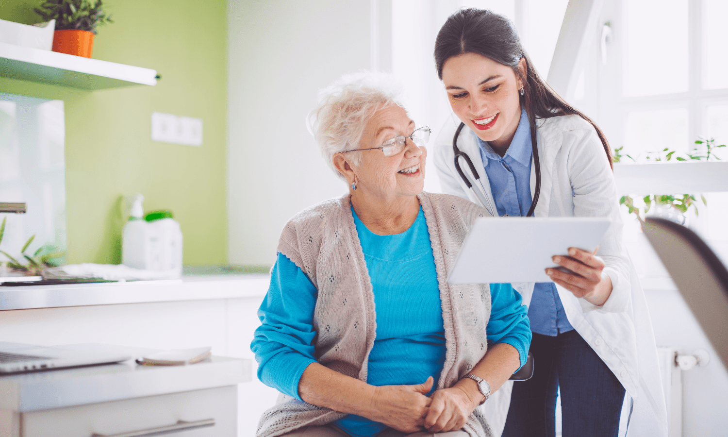Doctor explaining to her patient the risk factors of peripheral arterial disease.