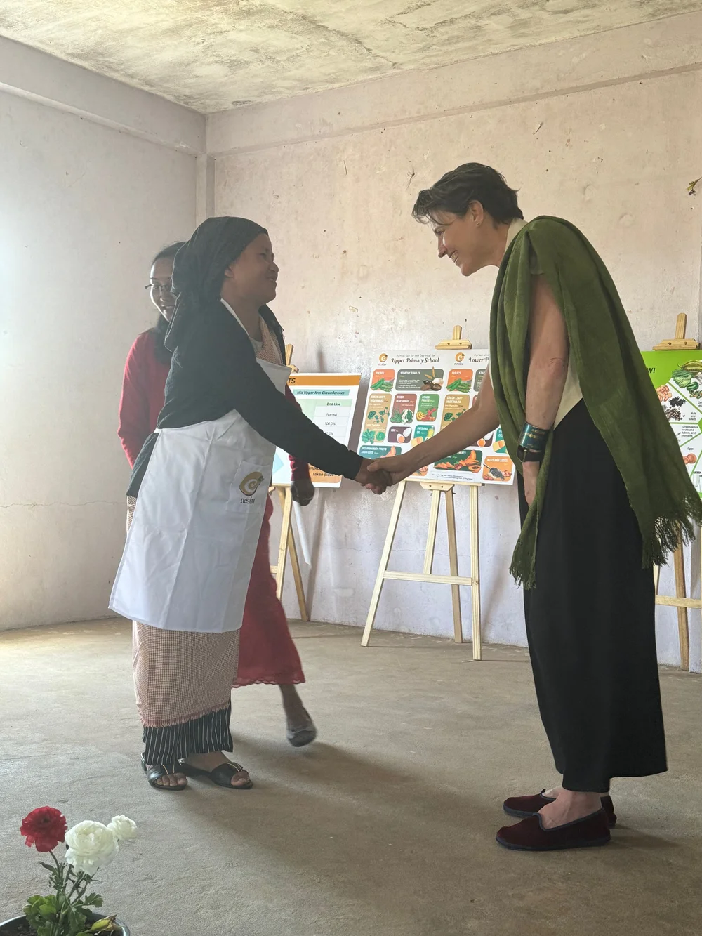 Congratulating one of the school lunch cooks