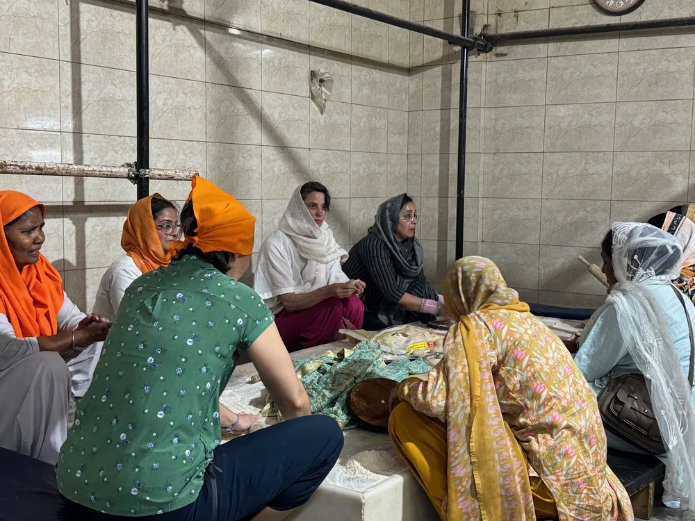 Helping to make bread at the Sikh Temple